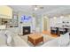 Living room with fireplace and TV and an adjacent kitchen with modern appliances at 104 Wando Reach Rd, Wando, SC 29492