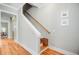 Hardwood staircase with white risers and a wooden handrail at 104 Wando Reach Rd, Wando, SC 29492