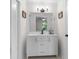 Bright bathroom featuring a white vanity with modern fixtures and a large mirror reflecting the bedroom at 109 Sawmill Dr, Summerville, SC 29483