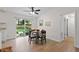 Charming dining area featuring a round wood table with seating for four and a sliding glass door leading to the backyard at 109 Sawmill Dr, Summerville, SC 29483
