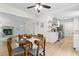 The dining area connects to the kitchen and features a trendy light fixture, and wood look floors at 109 Sawmill Dr, Summerville, SC 29483