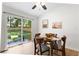 Dining area showcasing a sliding glass door leading to the backyard and bright, neutral paint at 109 Sawmill Dr, Summerville, SC 29483