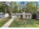 Charming single-story home featuring a well-maintained lawn, attached garage, and a cozy front porch entry at 109 Sawmill Dr, Summerville, SC 29483