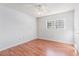A cozy bedroom with wood floors, a ceiling fan, and a window that provides natural light at 111 Elmwood Ave # A, Ladson, SC 29456