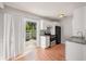 Bright kitchen featuring white cabinets, stainless appliances, and sliding door to patio at 111 Elmwood Ave # A, Ladson, SC 29456