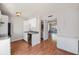 Kitchen offering white cabinets and stainless steel appliances with a view to the living room at 111 Elmwood Ave # A, Ladson, SC 29456
