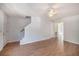 The living room features light gray walls, ceiling fan, wood floors and staircase to the upper level at 111 Elmwood Ave # A, Ladson, SC 29456