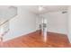 Spacious living room boasting wood floors, a ceiling fan, and an open layout to adjacent dining space at 111 Elmwood Ave # A, Ladson, SC 29456