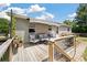 Enjoy outdoor living on the back deck with comfortable seating and retractable awning, perfect for relaxing or entertaining at 1125 Oceanview Rd, Charleston, SC 29412