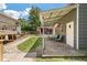 Landscaped backyard featuring a covered patio attached to an outbuilding and direct access to a lawn and deck at 1125 Oceanview Rd, Charleston, SC 29412