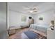 Bright bedroom features laminate flooring, a ceiling fan, and two windows that provide ample natural light at 1125 Oceanview Rd, Charleston, SC 29412