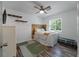 Bedroom features laminate flooring, natural light, and a decorative wood headboard at 1125 Oceanview Rd, Charleston, SC 29412