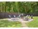 Charming backyard fire pit with seating area, ideal for relaxing evenings and outdoor entertaining at 1125 Oceanview Rd, Charleston, SC 29412
