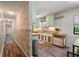 Stylish kitchen with wooden counters and unique backsplash accents open to a charming hallway feature wall at 1125 Oceanview Rd, Charleston, SC 29412