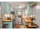 Galley kitchen with wood counters, stainless appliances, and convenient washer/dryer area for modern living at 1125 Oceanview Rd, Charleston, SC 29412