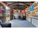 Outbuilding interior offering a relaxed atmosphere with seating, mini fridge, and unique wall decorations at 1125 Oceanview Rd, Charleston, SC 29412