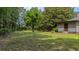 A well-maintained backyard featuring mature trees that provide shade to the property at 1129 Belvedere Ter, Mount Pleasant, SC 29464