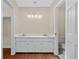 Well-lit bathroom featuring a double sink vanity with white cabinets and tile flooring at 1129 Belvedere Ter, Mount Pleasant, SC 29464