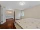 Bright bedroom with an ensuite bathroom area, featuring natural light and hardwood floors at 1129 Belvedere Ter, Mount Pleasant, SC 29464