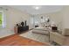 Well-lit bedroom with stylish decor, hardwood floors, and ample natural light at 1129 Belvedere Ter, Mount Pleasant, SC 29464