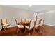 Elegant dining room featuring hardwood floors, a classic wooden table with seating for eight, and neutral walls at 1129 Belvedere Ter, Mount Pleasant, SC 29464
