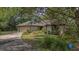 Charming single-story home with a well-manicured lawn, mature trees, and a convenient attached two-car garage at 1129 Belvedere Ter, Mount Pleasant, SC 29464
