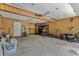 Spacious garage with wood paneling and ample storage space for vehicles and tools at 1129 Belvedere Ter, Mount Pleasant, SC 29464