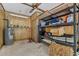 Well-organized garage storage with shelves and water heater, maximizing space and functionality at 1129 Belvedere Ter, Mount Pleasant, SC 29464