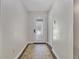 Bright entrance hallway with a patterned rug, white door with glass inserts, and neutral paint, creating a welcoming space at 1129 Belvedere Ter, Mount Pleasant, SC 29464