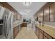 Open kitchen features granite countertops, stainless steel appliances, tile floors and custom cabinets at 1129 Belvedere Ter, Mount Pleasant, SC 29464