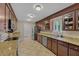 Spacious kitchen features granite countertops, stainless steel appliances, tile floors and custom cabinets at 1129 Belvedere Ter, Mount Pleasant, SC 29464