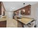 Well-lit kitchen with granite countertops, stainless steel appliances, tile floor, and custom cabinets at 1129 Belvedere Ter, Mount Pleasant, SC 29464