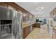 Bright, spacious kitchen with granite countertops, stainless steel appliances, tile floors and custom cabinets at 1129 Belvedere Ter, Mount Pleasant, SC 29464