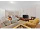 Comfortable living room with hardwood floors, a large TV, ample seating, and a welcoming atmosphere at 1129 Belvedere Ter, Mount Pleasant, SC 29464
