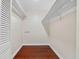 Spacious walk-in closet with wood floors, white walls, and built-in shelving providing ample storage at 1129 Belvedere Ter, Mount Pleasant, SC 29464
