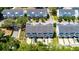 A high angle view shows the townhouse has a driveway, garden, and well-maintained landscaping at 114 Rowans Creek Dr, Charleston, SC 29492