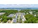 Expansive aerial view of the home, showcasing its beautiful surrounding neighborhood and serene river views in the background at 114 Rowans Creek Dr, Charleston, SC 29492