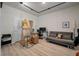 Functional art studio features natural lighting, futon, and a workspace with ample storage solutions at 114 Rowans Creek Dr, Charleston, SC 29492