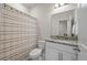 Bright bathroom with a granite countertop, ample mirror, and a shower-tub combination with a stylish curtain at 114 Rowans Creek Dr, Charleston, SC 29492