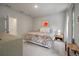 Bright bedroom showcasing a floral patterned bed, stylish furnishings, and soft, neutral decor throughout at 114 Rowans Creek Dr, Charleston, SC 29492