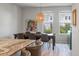 Bright dining room features a table with seating for six, a modern light fixture, and light wood floors at 114 Rowans Creek Dr, Charleston, SC 29492