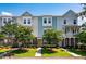 Charming townhouse with a mix of siding and brick, enhanced by well-maintained landscaping at 114 Rowans Creek Dr, Charleston, SC 29492