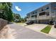 A view of the home shows a two-car garage, small porches, and a landscaped yard at 114 Rowans Creek Dr, Charleston, SC 29492