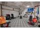 Spacious garage converted into a gym featuring workout equipment and ample space for fitness activities at 114 Rowans Creek Dr, Charleston, SC 29492