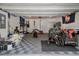 Functional garage space with gym equipment, ample storage and easy access through overhead door at 114 Rowans Creek Dr, Charleston, SC 29492