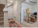 Hallway leading to art studio, featuring hardwood floors and inviting natural light at 114 Rowans Creek Dr, Charleston, SC 29492