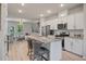 Open kitchen with a marble countertop island, stainless steel appliances, and seamless access to the living area at 114 Rowans Creek Dr, Charleston, SC 29492