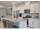 Contemporary kitchen featuring a marble island, stainless steel appliances, and seamless connection to the living area at 114 Rowans Creek Dr, Charleston, SC 29492
