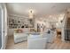 Open-concept living area with stylish seating, built-in shelving, and seamless flow to the kitchen at 114 Rowans Creek Dr, Charleston, SC 29492