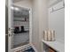 Well-organized mudroom with a built-in bench, hooks, and easy access to garage, perfect for storage at 114 Rowans Creek Dr, Charleston, SC 29492